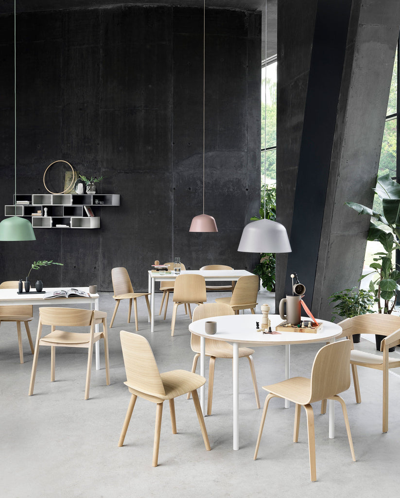 Embodying the values of Scandinavian design, the Ambit Pendant Lamp by Muuto is as timeless as it is contemporary. Made of hand-spun aluminum that has been hand-painted, the Ambit Pendant Lamp features clean lines and a white interior that heighten contrasts of its outside shade while enhancing the light emitted in any room of a home, office or commercial space. Use the design on its own or symmetric formations and vibrant clusters.