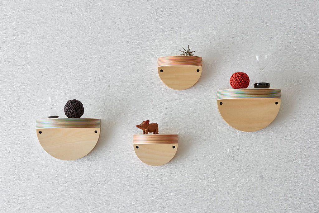 A wall shelf that can serve as a display space for your favorite books or accessories. It adds accent to your wall. Designed by Drill Design.