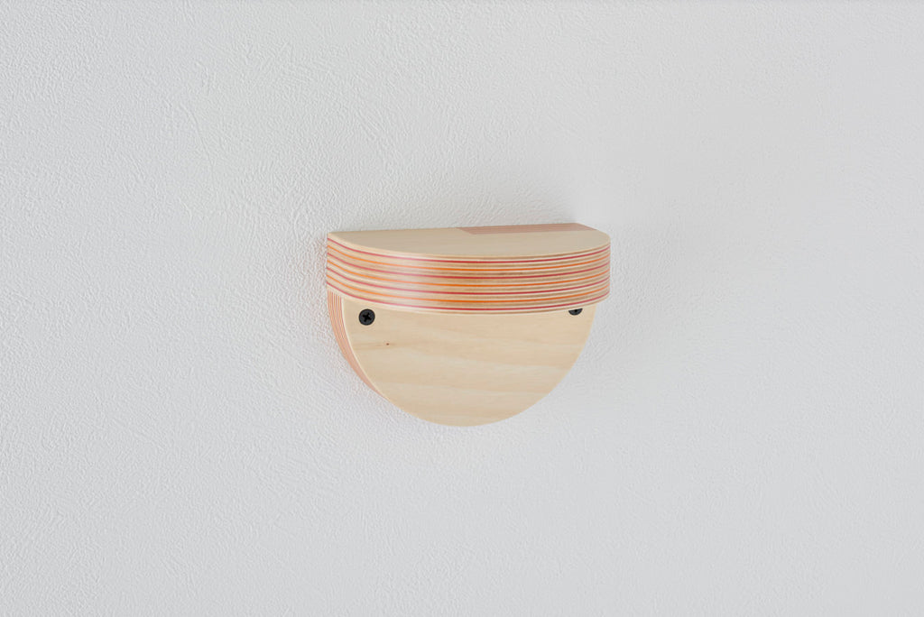A wall shelf that can serve as a display space for your favorite books or accessories. It adds accent to your wall. Designed by Drill Design.