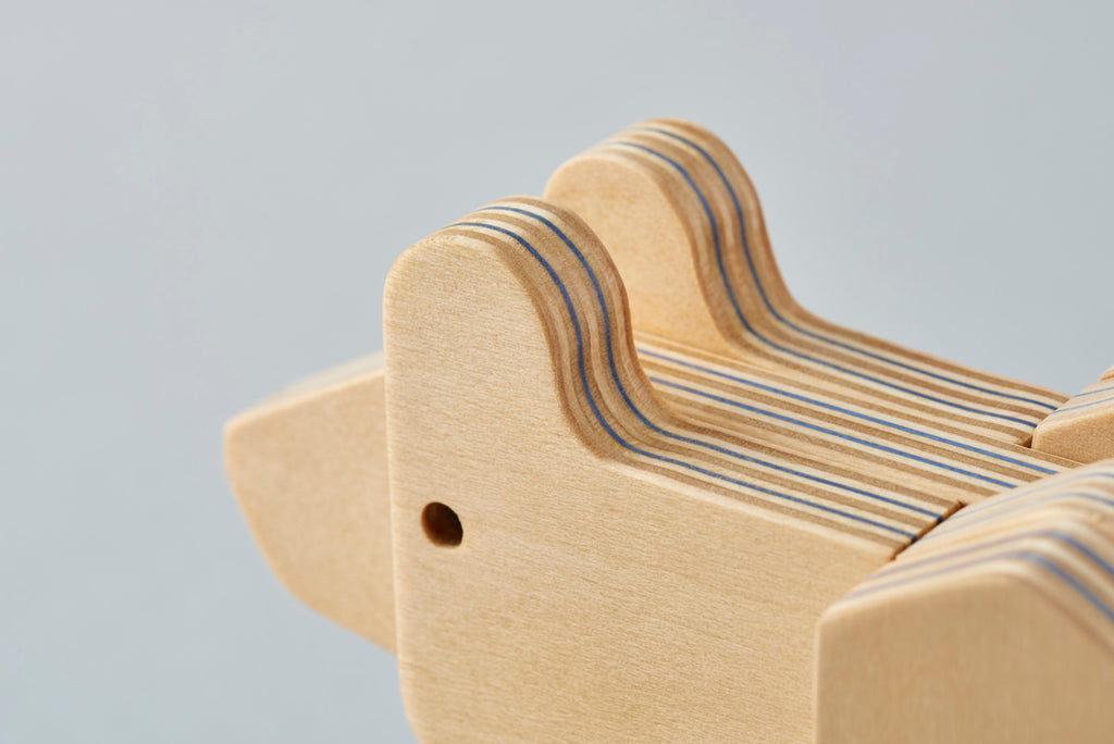 An animal block puzzle of a higuma (Japanese brown bear) that lives in Hokkaido in northern Japan. Here, a traditional bear woodcarving in Hokkaido has been redesigned into a 3D jigsaw puzzle. Designed by Drill Design.