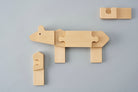 An animal block puzzle of a higuma (Japanese brown bear) that lives in Hokkaido in northern Japan. Here, a traditional bear woodcarving in Hokkaido has been redesigned into a 3D jigsaw puzzle. Designed by Drill Design.