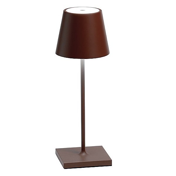    The Poldina Mini Table Lamp by Ai Lati Lights for Zafferano features a sleek and small body and offers a crisp and bright light to its setting. Ideal for indoor and outdoor settings with its 9 hour rechargeable battery life and portable body makes the perfect accent to a space. The fixture is made up of painted aluminium with a polycarbonate diffuser and LED light source. Its square base ensures a sturdy display.