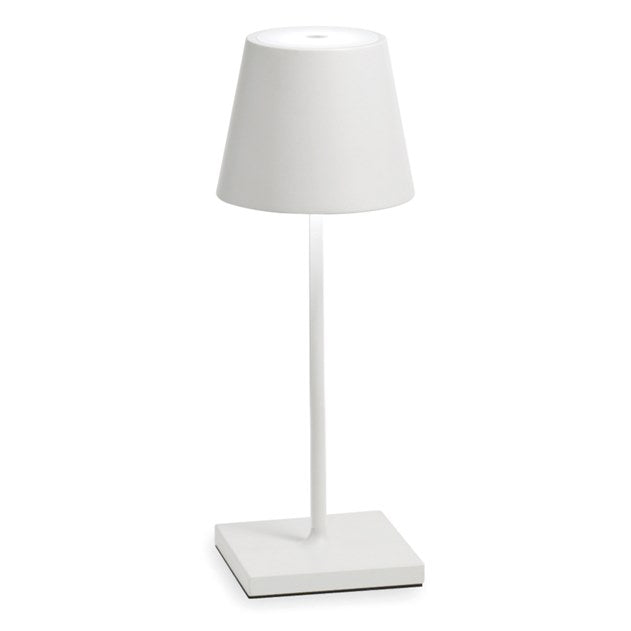    The Poldina Mini Table Lamp by Ai Lati Lights for Zafferano features a sleek and small body and offers a crisp and bright light to its setting. Ideal for indoor and outdoor settings with its 9 hour rechargeable battery life and por