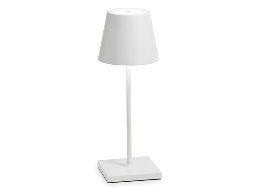    The Poldina Mini Table Lamp by Ai Lati Lights for Zafferano features a sleek and small body and offers a crisp and bright light to its setting. Ideal for indoor and outdoor settings with its 9 hour rechargeable battery life and portable body makes the perfect accent to a space. The fixture is made up of painted aluminium with a polycarbonate diffuser and LED light source. Its square base ensures a sturdy display.