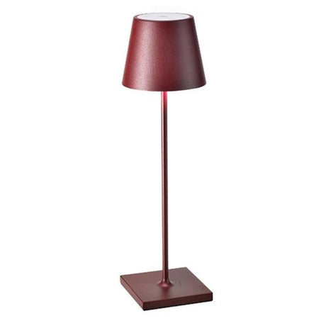 The Poldina Pro Table Lamp by Ai Lati Lights for Zafferano features a sleek and small body and offers a crisp and bright light to its setting. Ideal for indoor and outdoor settings with its 9-hour rechargeable battery life and portable body makes the perfect accent to a space. The fixture is made up of painted aluminum with a polycarbonate diffuser and LED light source. Its square base ensures a sturdy display.