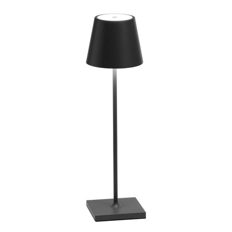 The Poldina Pro Table Lamp by Ai Lati Lights for Zafferano features a sleek and small body and offers a crisp and bright light to its setting. Ideal for indoor and outdoor settings with its 9-hour rechargeable battery life and portable body makes the perfect accent to a space. The fixture is made up of painted aluminum with a polycarbonate diffuser and LED light source. Its square base ensures a sturdy display.
