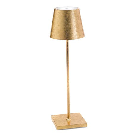 The Poldina Pro Table Lamp by Ai Lati Lights for Zafferano features a sleek and small body and offers a crisp and bright light to its setting. Ideal for indoor and outdoor settings with its 9-hour rechargeable battery life and portable body makes the perfect accent to a space. The fixture is made up of painted aluminum with a polycarbonate diffuser and LED light source. Its square base ensures a sturdy display.