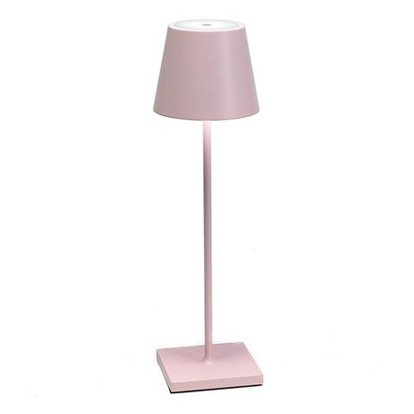 The Poldina Pro Table Lamp by Ai Lati Lights for Zafferano features a sleek and small body and offers a crisp and bright light to its setting. Ideal for indoor and outdoor settings with its 9-hour rechargeable battery life and portable body makes the perfect accent to a space. The fixture is made up of painted aluminum with a polycarbonate diffuser and LED light source. Its square base ensures a sturdy display.
