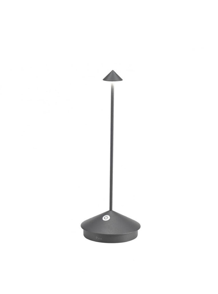 The Pina Pro Rechargeable Lamp by Ai Lati for Zafferano features a sleek and small body and wide base to anchor the lamp. Its clean design perfectly suits small settings offering a crisp and bright light to a space. Features a die-cast LED lamp with polycarbonate diffuser, 13+ hours of rechargeable battery life, and portable body makes the Pina Pro an excellent accents to a space. Touch-dimmable. Contact charging base with USB cable included. Suitable for indoor or outdoor use.