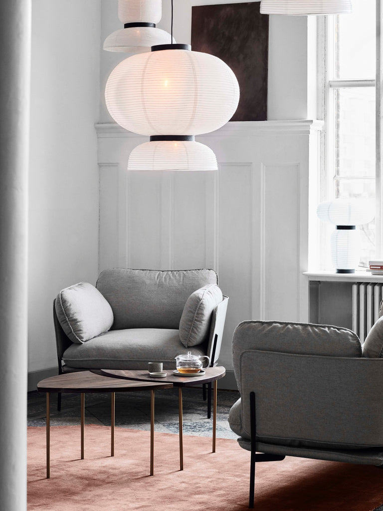  Here Hayon has dispensed with cultural formalities to create a series of lamps all in white. Hand crafted with rice paper merging various sizes and shapes together. The series is comprised of three different lantern versions and a table lamp in ivory white rice paper with black stained oak accents.