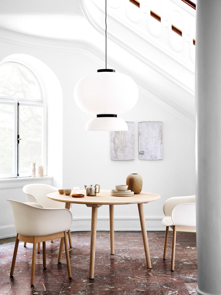  Here Hayon has dispensed with cultural formalities to create a series of lamps all in white. Hand crafted with rice paper merging various sizes and shapes together. The series is comprised of three different lantern versions and a table lamp in ivory white rice paper with black stained oak accents.
