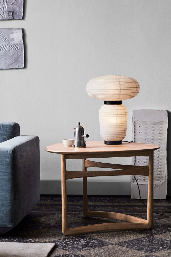 Here Hayon has dispensed with cultural formalities to create a series of lamps all in white. Hand crafted with rice paper merging various sizes and shapes together. The series is comprised of three different lantern versions and a table lamp in ivory white rice paper with black stained oak accents.