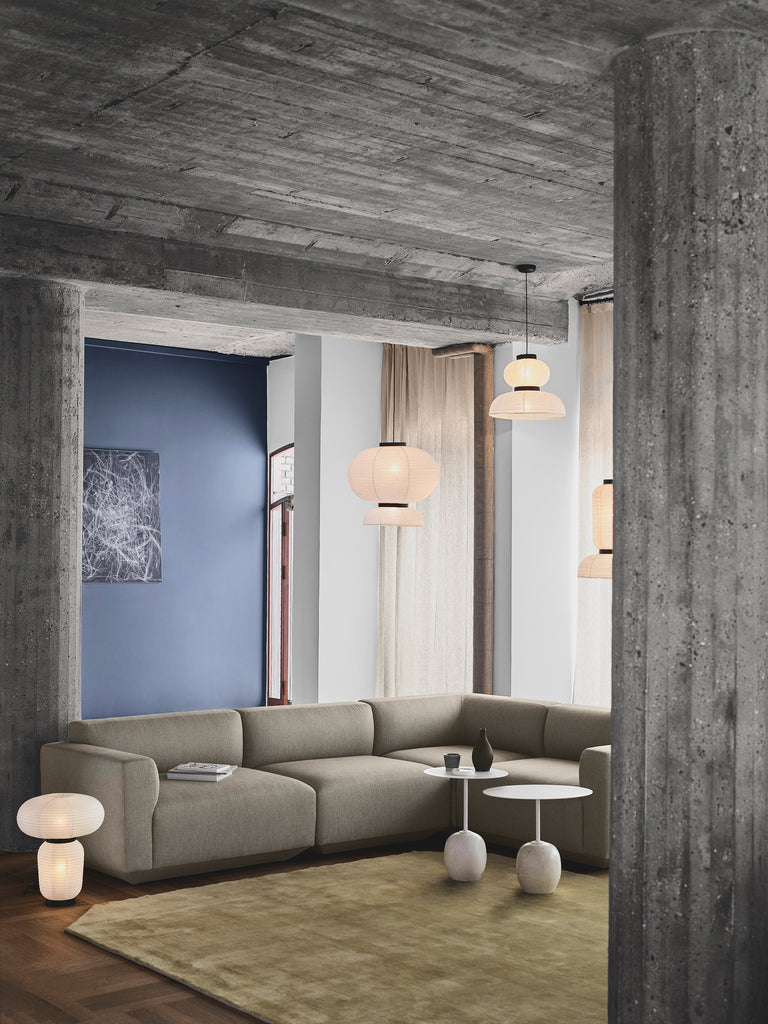 Hand crafted with rice paper merging various sizes and shapes together. The series is comprised of three different lantern versions and a table lamp in ivory white rice paper with black stained oak accents.