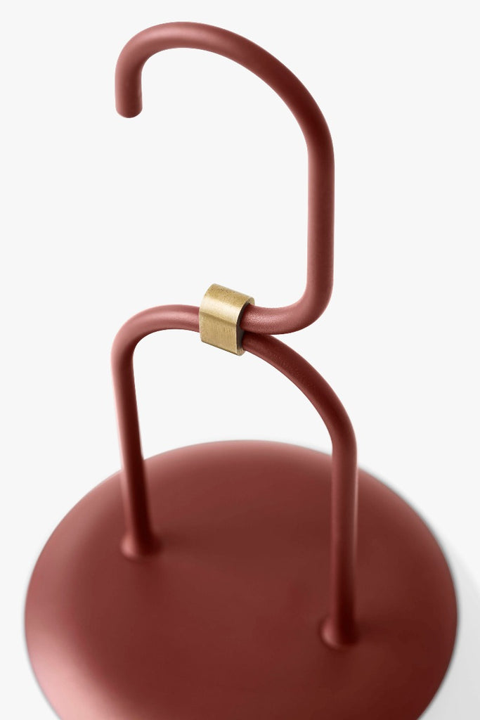 The Lucca Portable Table Lamp by Space Copenhagen for &Tradition. This elegant portable lamp, inspired by the golden glow of the Tuscan city of Lucca, mimics the warmth of the city’s nocturnal light.