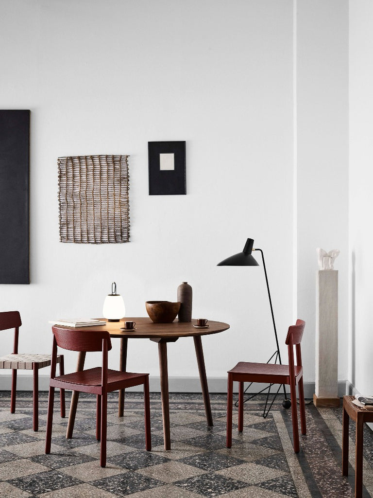 The Lucca Portable Table Lamp by Space Copenhagen for &Tradition. This elegant portable lamp, inspired by the golden glow of the Tuscan city of Lucca, mimics the warmth of the city’s nocturnal light.