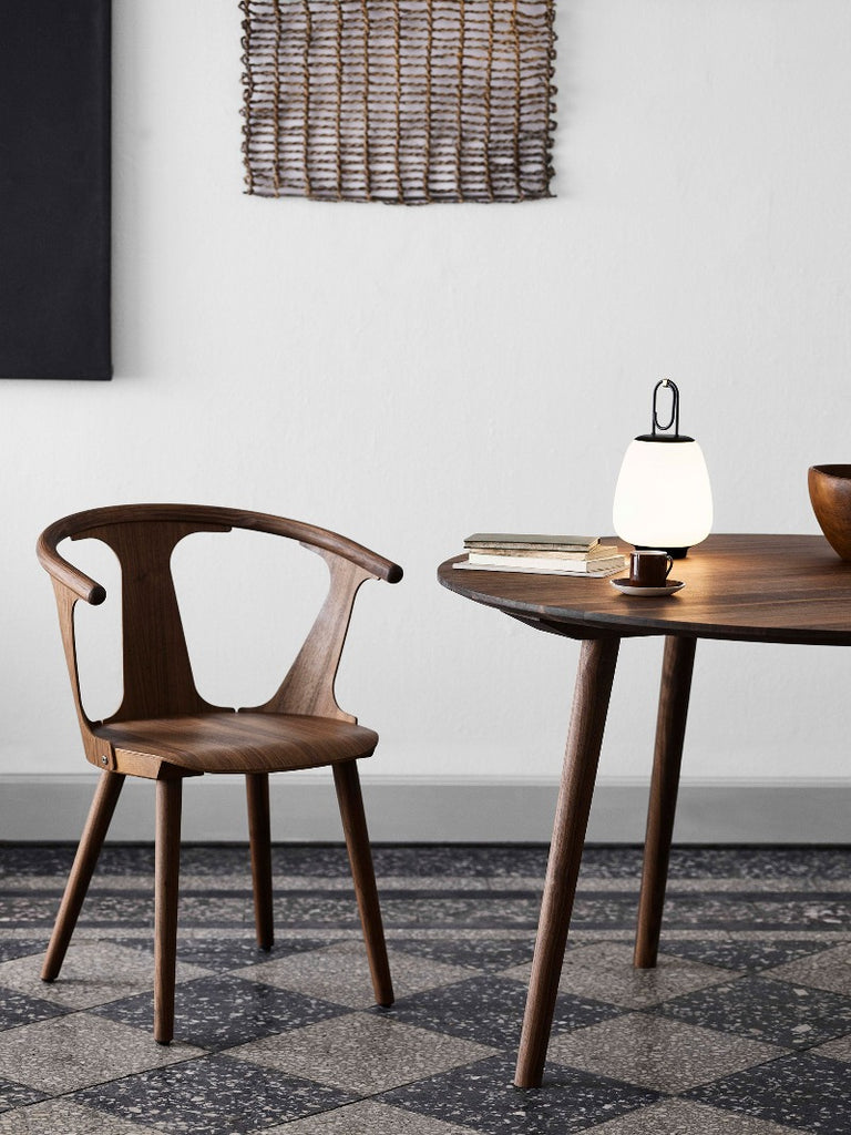 The Lucca Portable Table Lamp by Space Copenhagen for &Tradition. This elegant portable lamp, inspired by the golden glow of the Tuscan city of Lucca, mimics the warmth of the city’s nocturnal light.