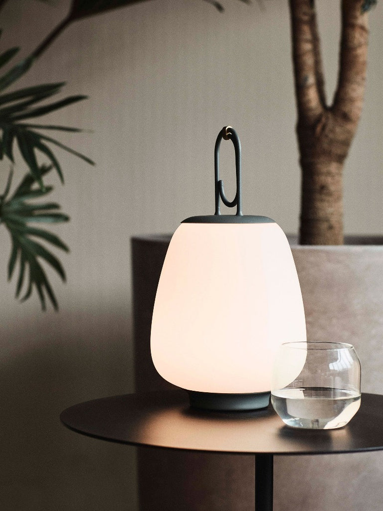 The Lucca Portable Table Lamp by Space Copenhagen for &Tradition. This elegant portable lamp, inspired by the golden glow of the Tuscan city of Lucca, mimics the warmth of the city’s nocturnal light.