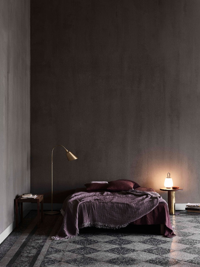 The Lucca Portable Table Lamp by Space Copenhagen for &Tradition. This elegant portable lamp, inspired by the golden glow of the Tuscan city of Lucca, mimics the warmth of the city’s nocturnal light.