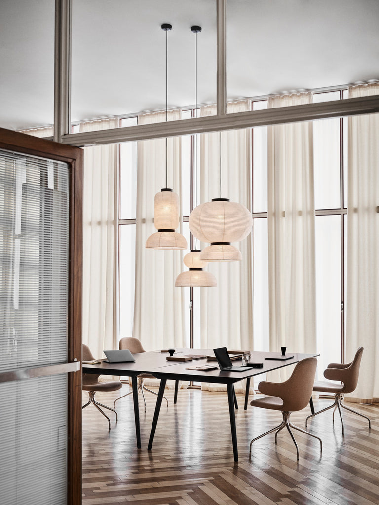 The JH3 Formakami Paper Lantern. Hand crafted with rice paper merging various sizes and shapes together. The series is comprised of three different lantern versions and a table lamp in ivory white rice paper with black stained oak accents.