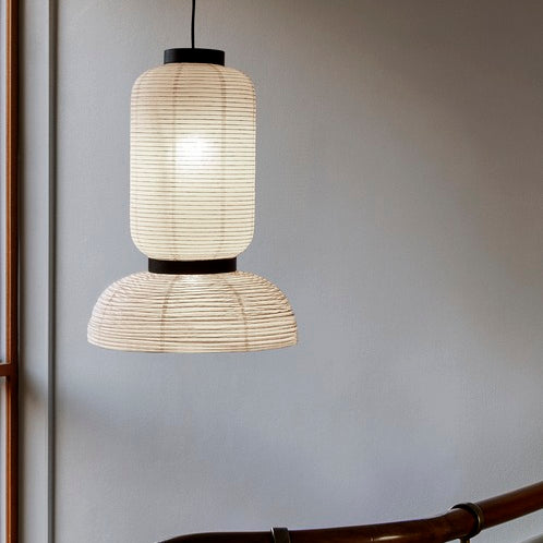 The JH3 Formakami Paper Lantern. Hand crafted with rice paper merging various sizes and shapes together. The series is comprised of three different lantern versions and a table lamp in ivory white rice paper with black stained oak accents.