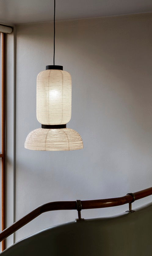 The JH3 Formakami Paper Lantern. Hand crafted with rice paper merging various sizes and shapes together. The series is comprised of three different lantern versions and a table lamp in ivory white rice paper with black stained oak accents.
