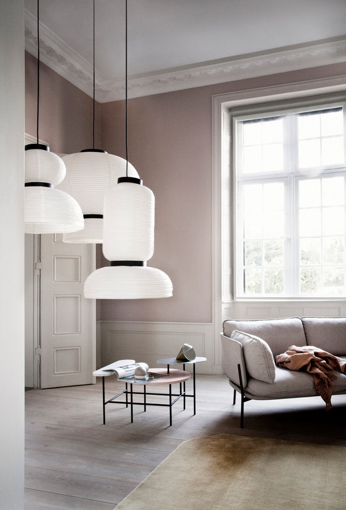 The JH3 Formakami Paper Lantern. Hand crafted with rice paper merging various sizes and shapes together. The series is comprised of three different lantern versions and a table lamp in ivory white rice paper with black stained oak accents.