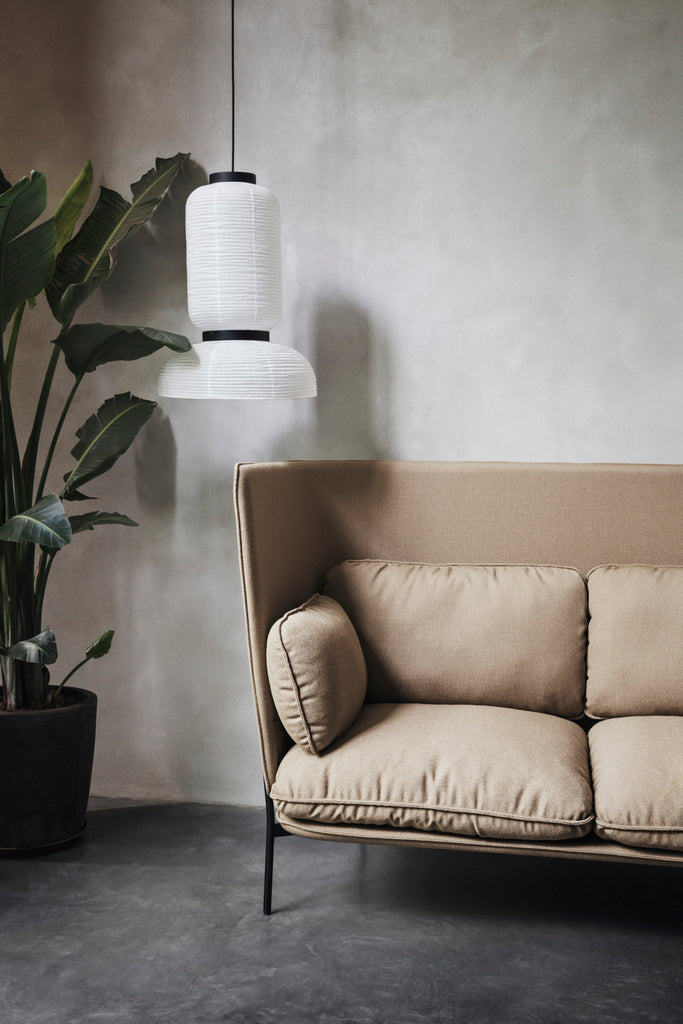 The JH3 Formakami Paper Lantern. Hand crafted with rice paper merging various sizes and shapes together. The series is comprised of three different lantern versions and a table lamp in ivory white rice paper with black stained oak accents.