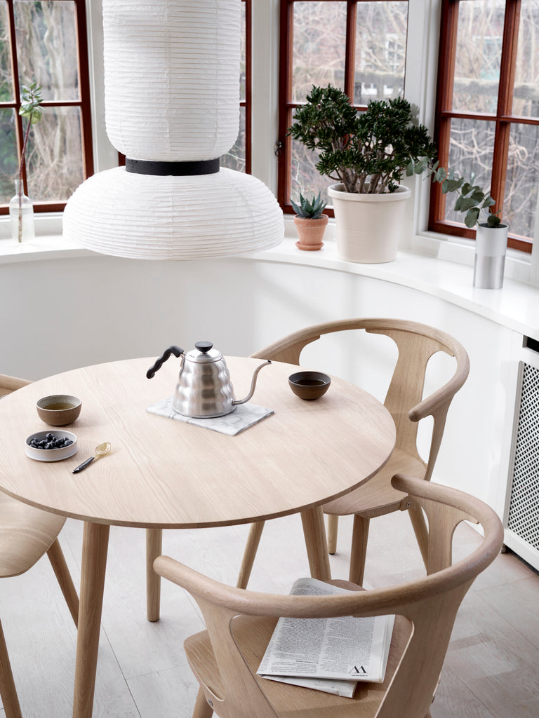 The JH3 Formakami Paper Lantern. Hand crafted with rice paper merging various sizes and shapes together. The series is comprised of three different lantern versions and a table lamp in ivory white rice paper with black stained oak accents.