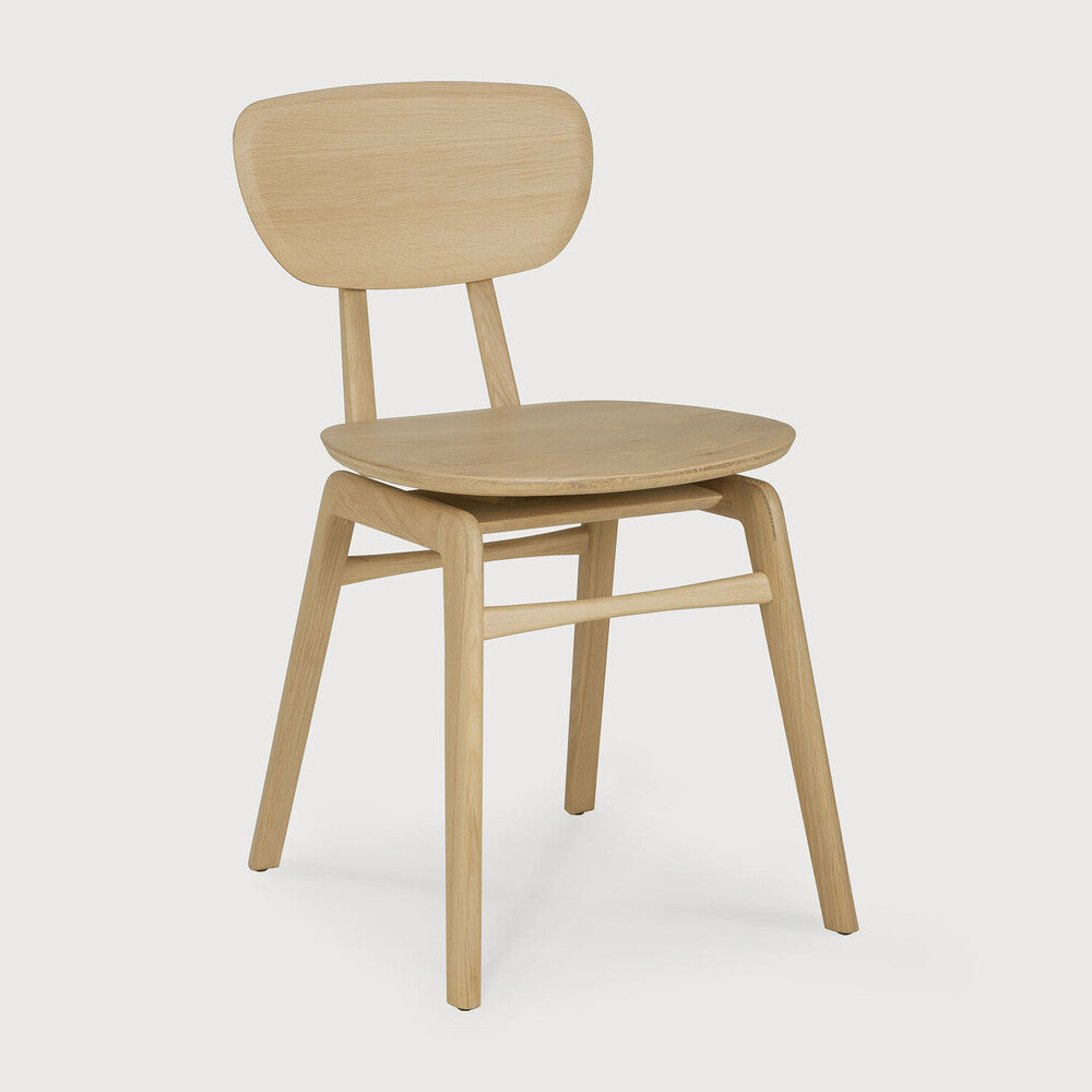 A nostalgic interpretation made with solid wood. The Pebble chair’s soft lines and airy elements provides not only seating comfort, but the familiar stylish shapes we have grown up loving. Designed by Alain Van Havre.
