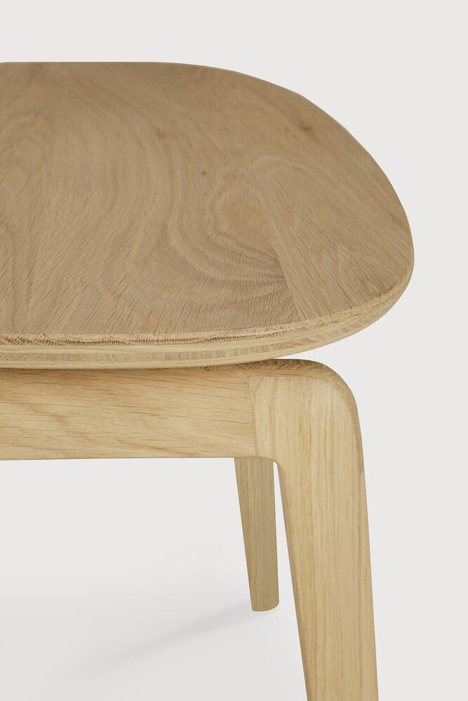 A nostalgic interpretation made with solid wood. The Pebble chair’s soft lines and airy elements provides not only seating comfort, but the familiar stylish shapes we have grown up loving. Designed by Alain Van Havre.