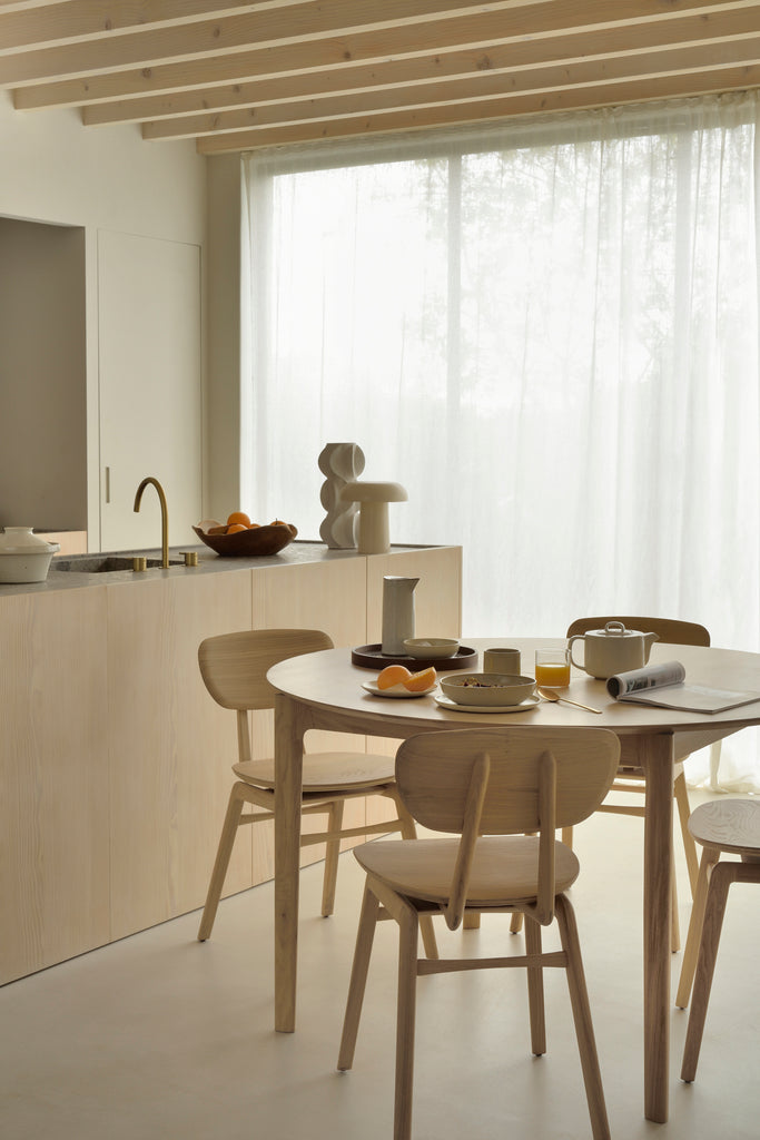 A nostalgic interpretation made with solid wood. The Pebble chair’s soft lines and airy elements provides not only seating comfort, but the familiar stylish shapes we have grown up loving. Designed by Alain Van Havre.