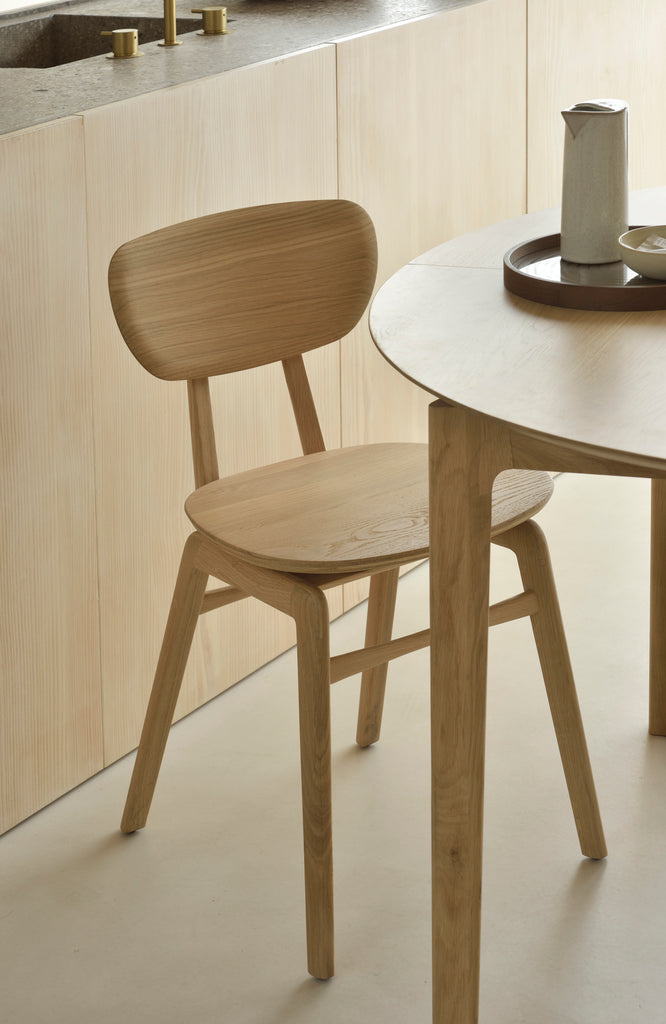 A nostalgic interpretation made with solid wood. The Pebble chair’s soft lines and airy elements provides not only seating comfort, but the familiar stylish shapes we have grown up loving. Designed by Alain Van Havre.