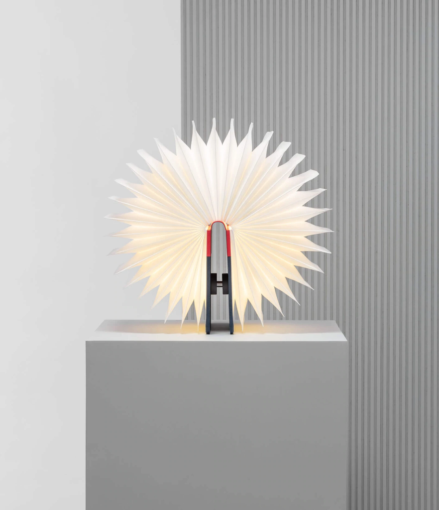 When closed, Lumio's Lito is a lamp concealed as a handsomely crafted, hard-cover book. Open it and it transforms into a sculptural light, radiating a warm glow.