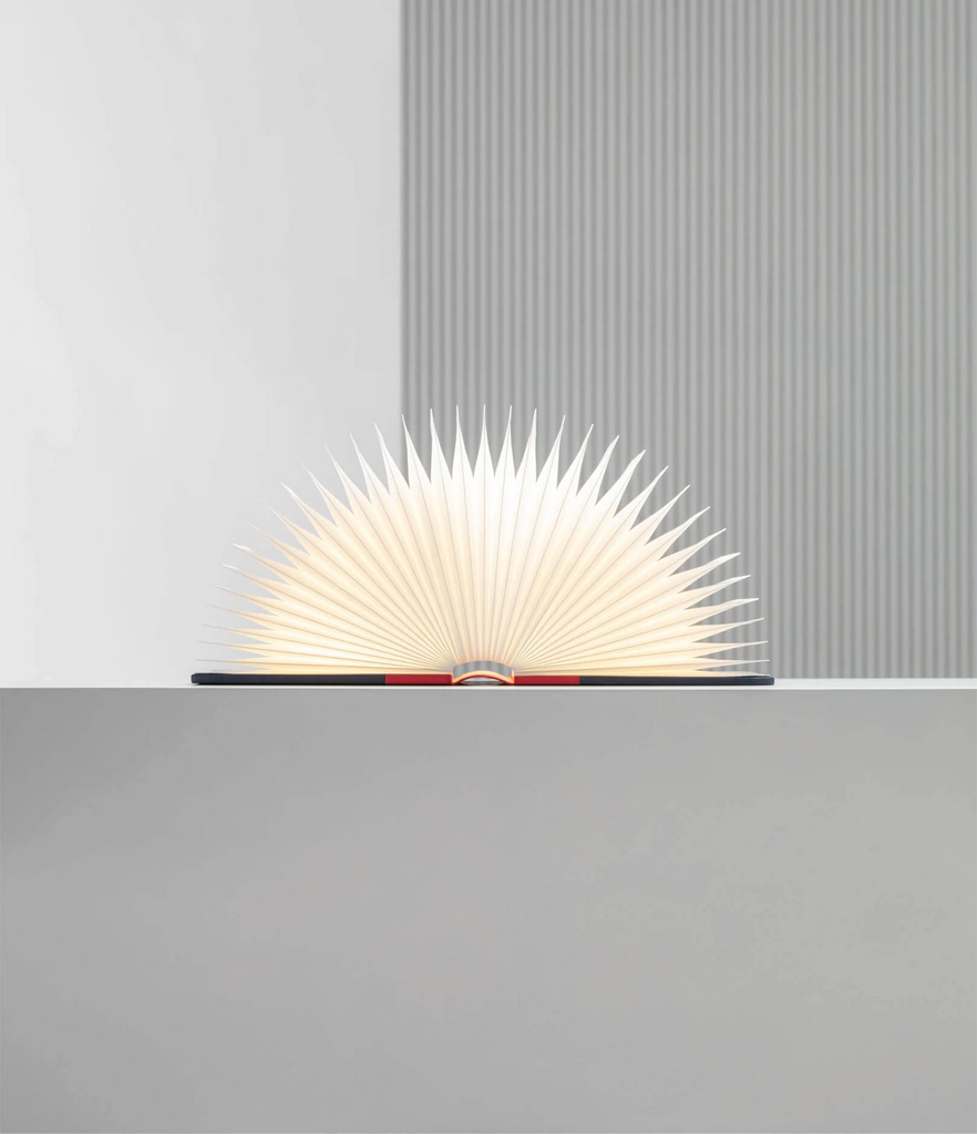 When closed, Lumio's Lito is a lamp concealed as a handsomely crafted, hard-cover book. Open it and it transforms into a sculptural light, radiating a warm glow.