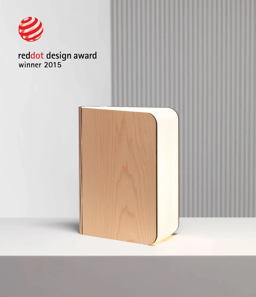 When closed, Lumio's Lito Classic Book Lamp is concealed as a handsomely crafted, hard-cover wooden book. Open it and it transforms into a sculptural light, radiating a warm glow.