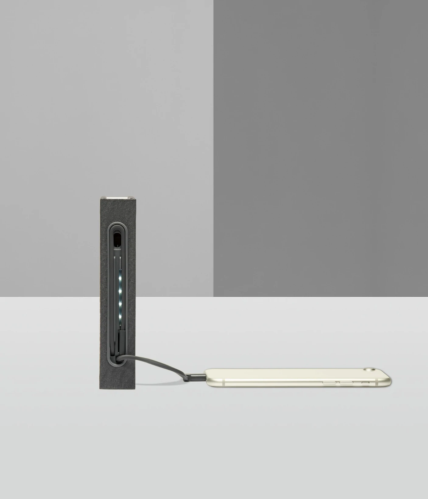 Lito mini is a compact, multi-functional portable lamp and battery pack for mobile phones that conceals itself in the form of a hard-cover book.