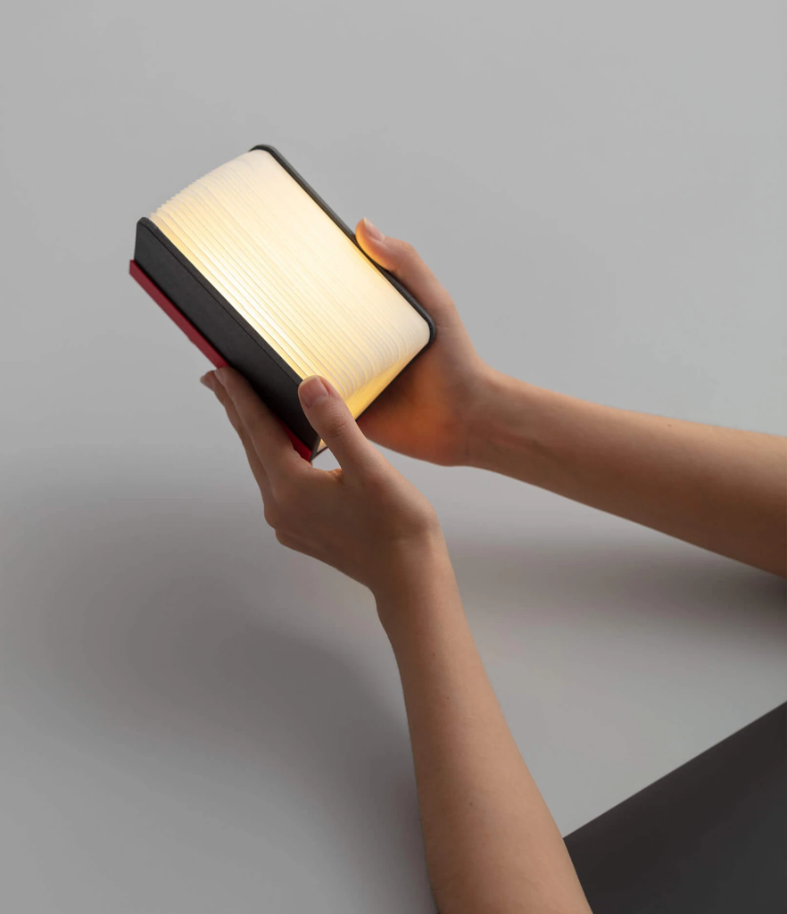 Lito mini is a compact, multi-functional portable lamp and battery pack for mobile phones that conceals itself in the form of a hard-cover book.