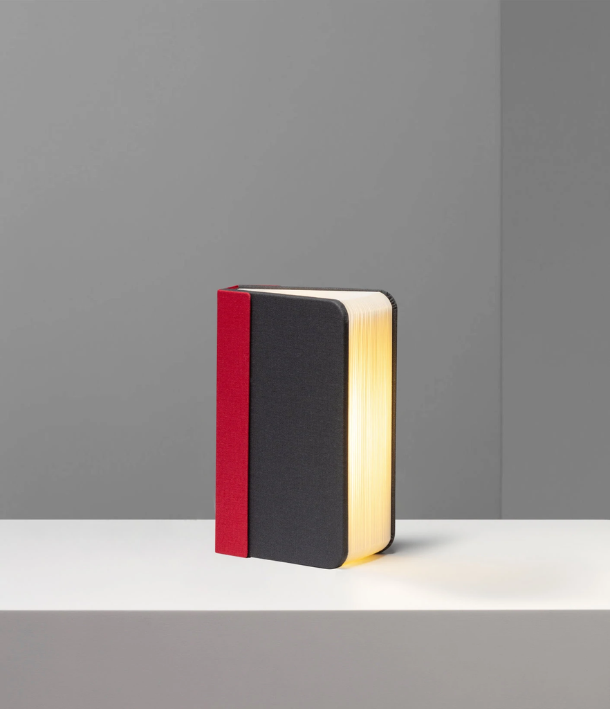 Lito mini is a compact, multi-functional portable lamp and battery pack for mobile phones that conceals itself in the form of a hard-cover book.
