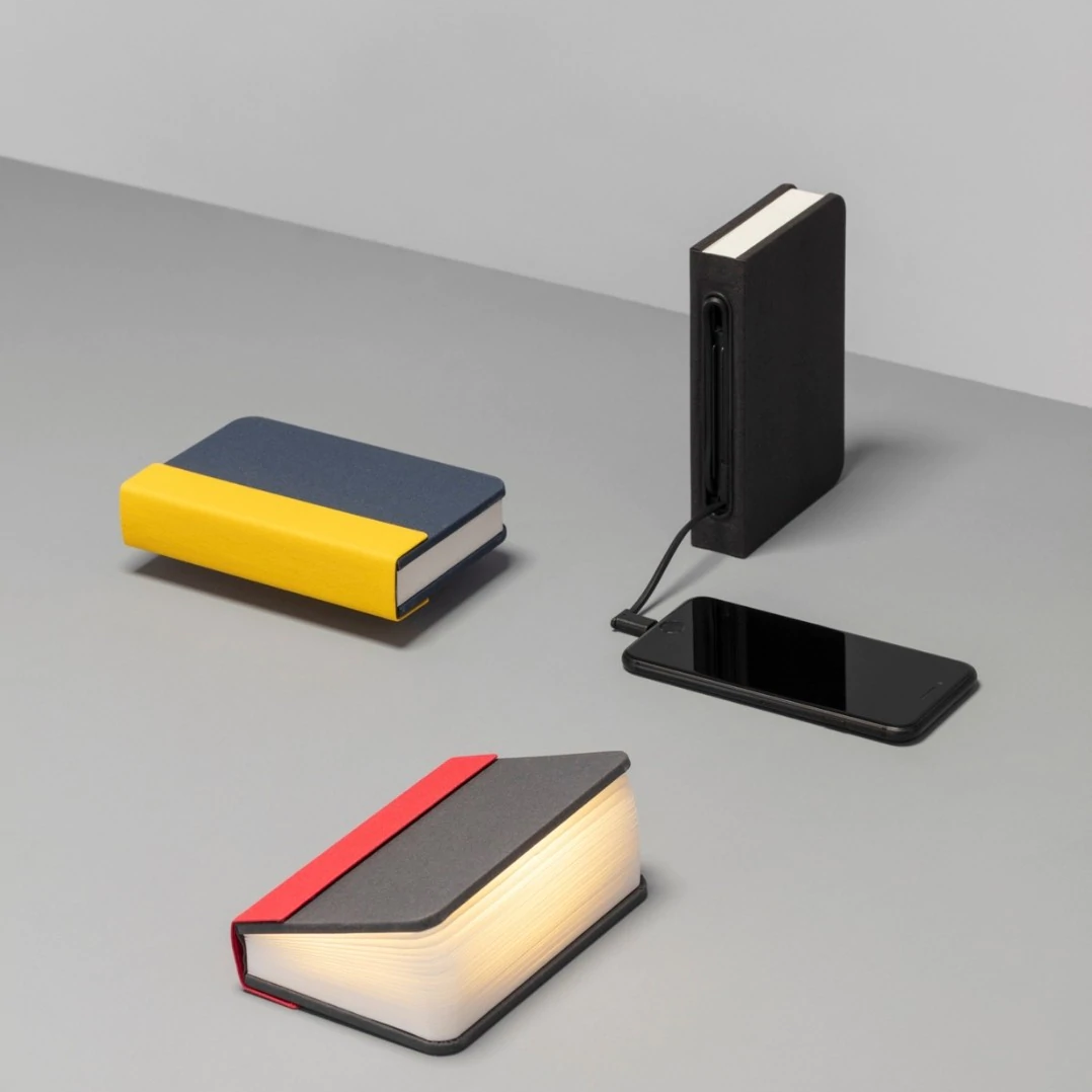 Lito mini is a compact, multi-functional portable lamp and battery pack for mobile phones that conceals itself in the form of a hard-cover book.