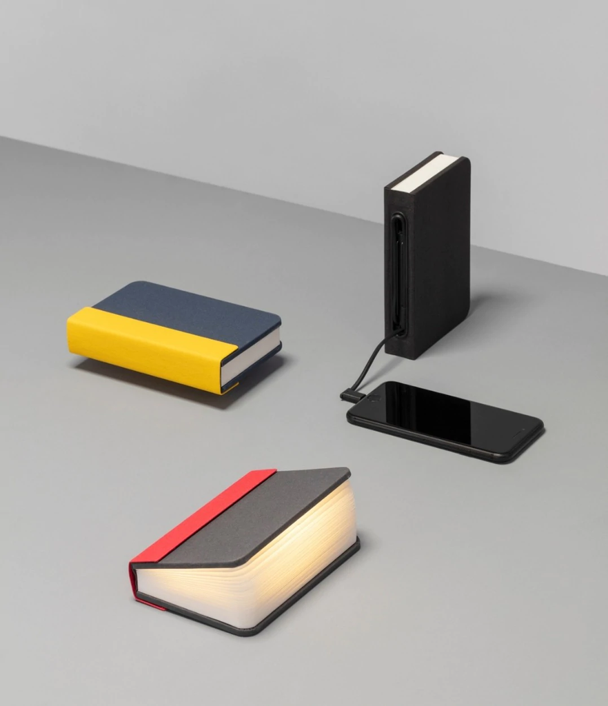 Lito mini is a compact, multi-functional portable lamp and battery pack for mobile phones that conceals itself in the form of a hard-cover book.