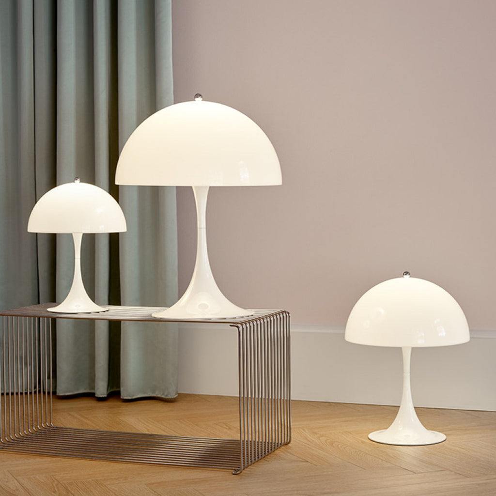 Verner Panton's classic Panthella Table Lamp was created in collaboration with Louis Poulsen in 1971. Panton’s figurative and playful design radiates his larger-than-life personality. Without compromising on quality or functionality, Panthella stands out with its organic shape, which mirrors the softest of light. With its non-glaring light, Panthella serves as a beautiful example of Panton's brilliant ability to create atmospheric illumination. 