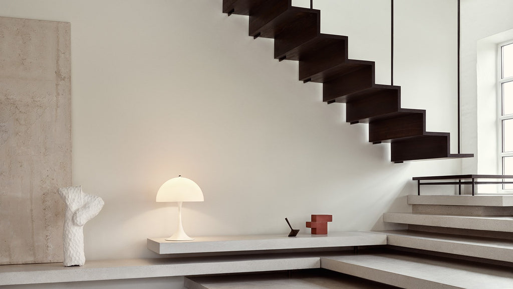 Verner Panton's classic Panthella Table Lamp was created in collaboration with Louis Poulsen in 1971. Panton’s figurative and playful design radiates his larger-than-life personality. Without compromising on quality or functionality, Panthella stands out with its organic shape, which mirrors the softest of light. With its non-glaring light, Panthella serves as a beautiful example of Panton's brilliant ability to create atmospheric illumination. 