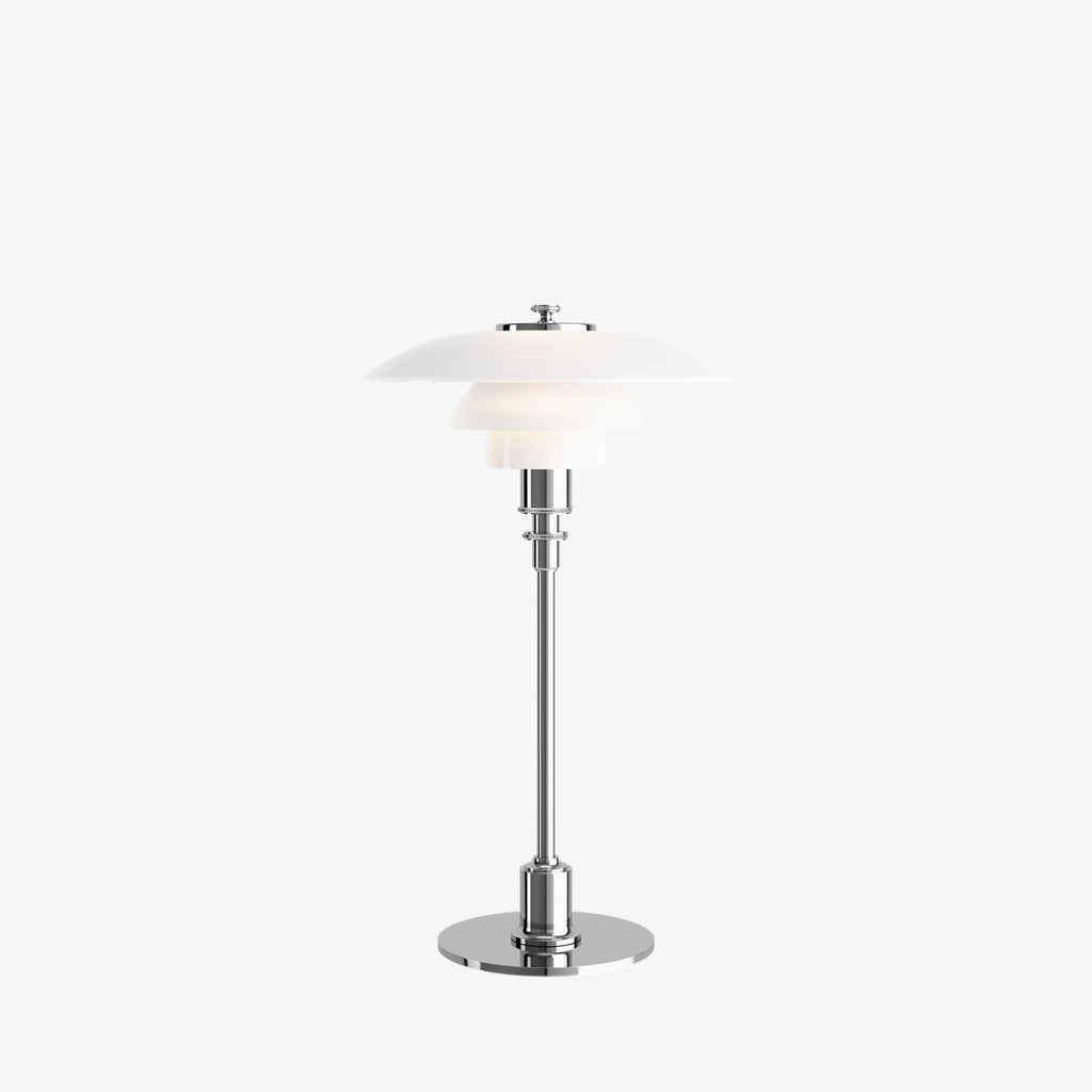 The PH 2/1 Table Light by Paul Henningsen for Louis Poulsen features a triple-layer hand blown glass shade that rests on a beautiful, lightly brushed brass frame, which references the original PH Table Lamp from 1927. Its design evokes timeless elegance with its use of classic materials. Complimenting environments both simple and eclectic, the PH 2/1 boasts a small profile making the lamp endlessly adaptable anywhere within the home, like on a windowsill or small table. 