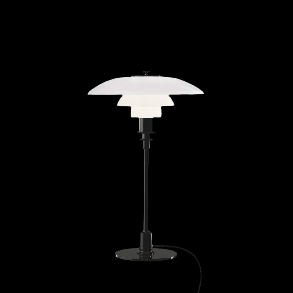 The PH 3/2 Table Light by Paul Henningsen for Louis Poulsen features a reflective three-shade system, which directs the majority of the light downwards. The shades are made of hand-blown opal three-layer glass, which is glossy on top and sandblasted matte on the underside, giving a soft and diffused light distribution.