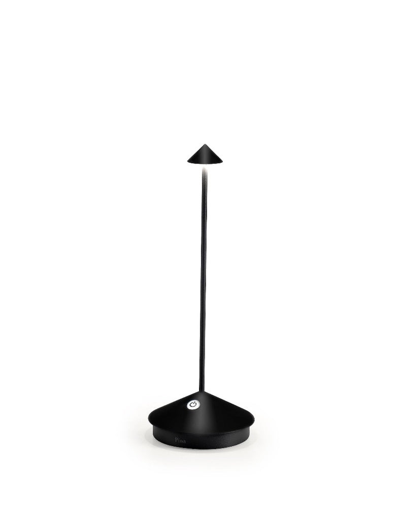 The Pina Pro Rechargeable Lamp by Ai Lati for Zafferano features a sleek and small body and wide base to anchor the lamp. Its clean design perfectly suits small settings offering a crisp and bright light to a space. Features a die-cast LED lamp with polycarbonate diffuser, 13+ hours of rechargeable battery life, and portable body makes the Pina Pro an excellent accents to a space. Touch-dimmable. Contact charging base with USB cable included. Suitable for indoor or outdoor use.