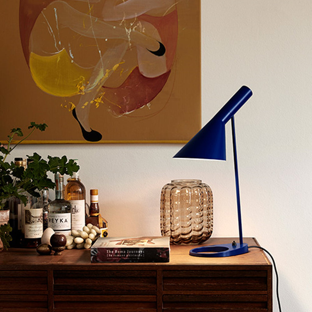 The fixture emits downward-directed light. The angle of the shade can be adjusted to optimize light distribution. The shade is painted white on the inside to ensure a soft comfortable light.
