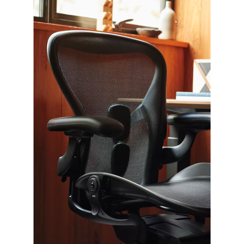 The Aeron office chair by Herman Miller revolutionized office seating with its defining design qualities: the pioneering Pellicle suspension material and its patented PostureFit SL back support, which affords the ideal sit — chest open, shoulders back, pelvis tilted slightly forward. 
