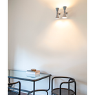 The mini version of the iconic Applique de Marseille, designed by Le Corbusier for his Parisian flat in Rue Nungesser et Coli. This wall lamp provides direct and diffused light through its two cone-shaped lampshades that direct the light up and down, providing homogenous and sharp light beams.