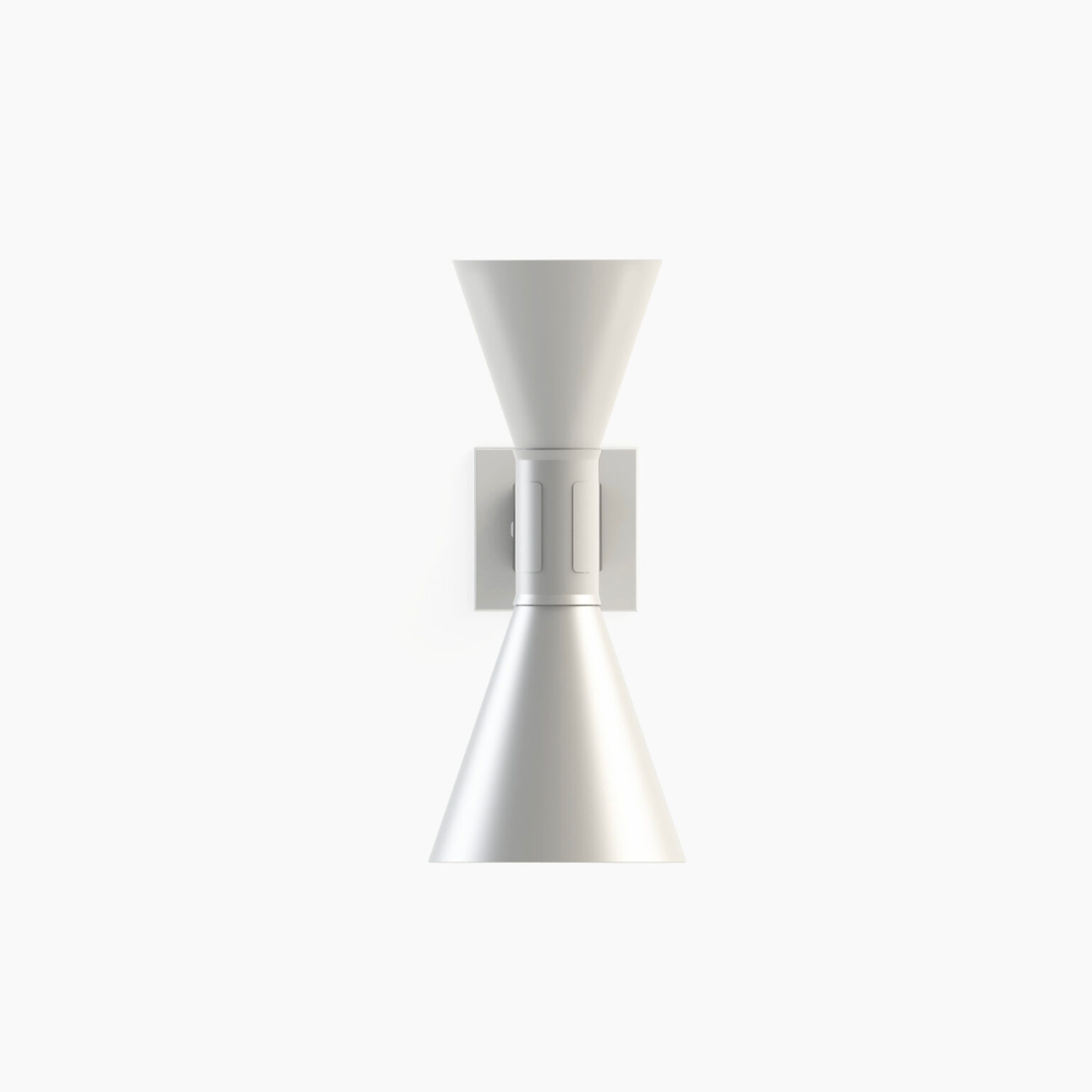 This wall sconce features double emission up and down light, in aluminum painted matte grey, matte white, or black, with white internal diffusers.