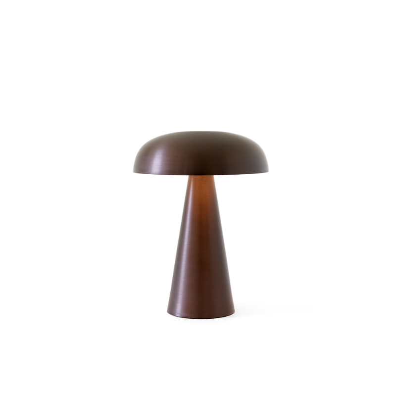 Match lighting to mood with Como SC53, a portable table lamp from Space Copenhagen. Crafted from anodized aluminum, Como’s sturdy base tapers up towards a soft curved, mushroom-shaped shade. This battery-powered lamp can operate for eleven hours at the highest setting, with an extra battery option that allows additional operating. It is easily recharged with a magnetic USB cable or a charging tray.